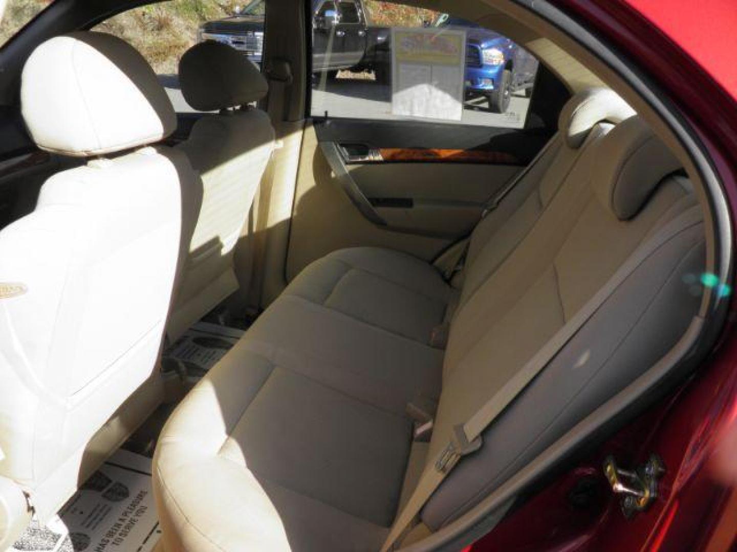 2007 Red /Neutral Cloth Seats Chevrolet Aveo LS 4-Door (KL1TD56627B) with an 1.6L I4 engine, AT transmission, located at 15520 McMullen Hwy SW, Belair, MD, 21502, (301) 729-3700, 39.581375, -78.846451 - Photo#3