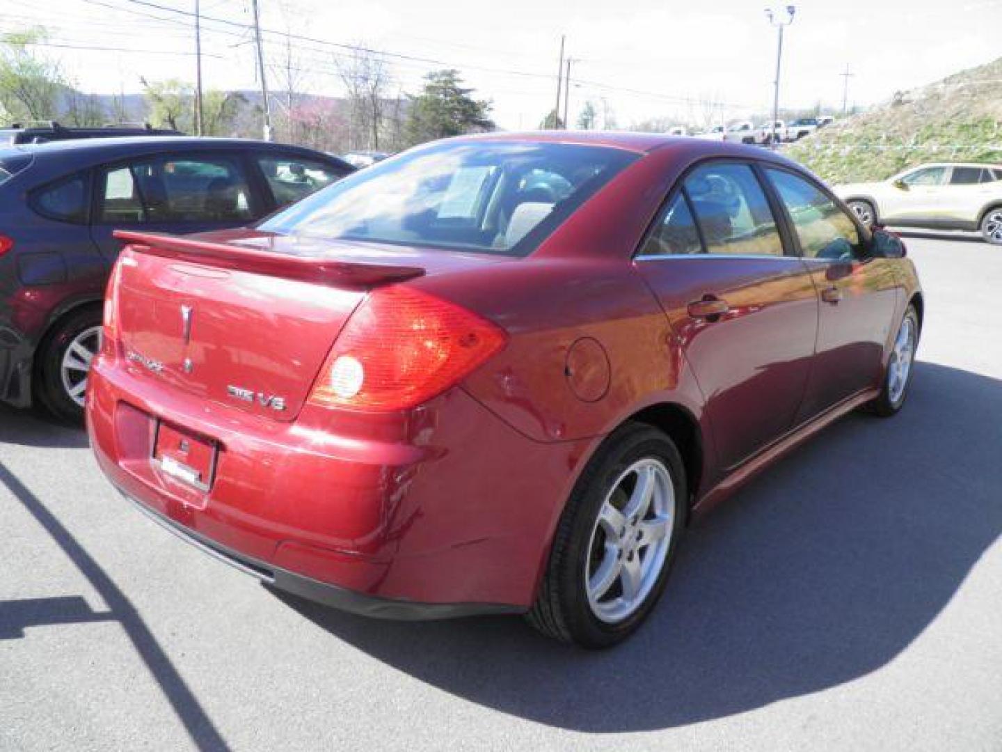 2009 RED Pontiac G6 Sedan (1G2ZJ57K794) with an 3.5L V6 OHV 12V engine, AT transmission, located at 15520 McMullen Hwy SW, Belair, MD, 21502, (301) 729-3700, 39.581375, -78.846451 - Photo#4