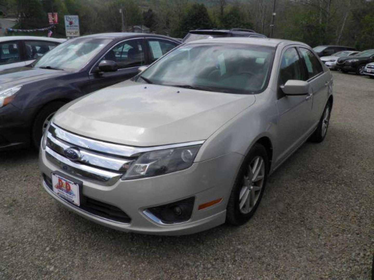 2010 GOLD Ford Fusion SEL (3FAHP0JA2AR) with an 2.5 L4 engine, AT transmission, located at 19521 New George's Creek Rd SW, Barton, MD, 21521, (301) 463-2404, 39.524323, -79.017906 - Photo#0