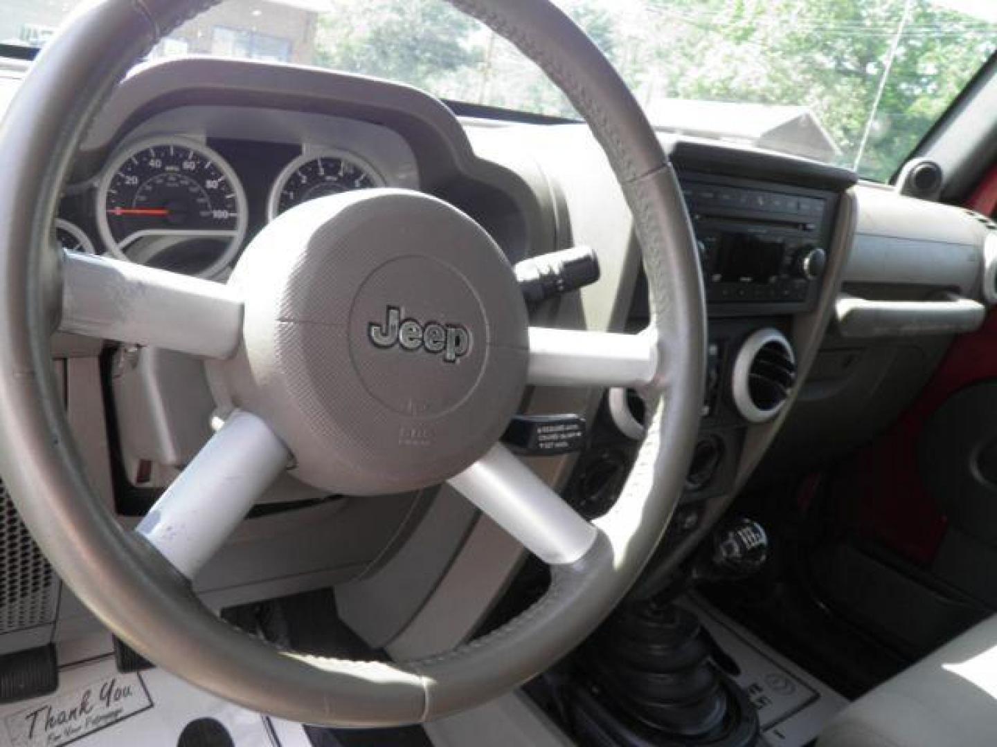2010 Red Jeep Wrangler Unlimited Sahara 4WD (1J4BA5H13AL) with an 3.8L V6 engine, MAN transmission, located at 19521 New George's Creek Rd SW, Barton, MD, 21521, (301) 463-2404, 39.524323, -79.017906 - Photo#2