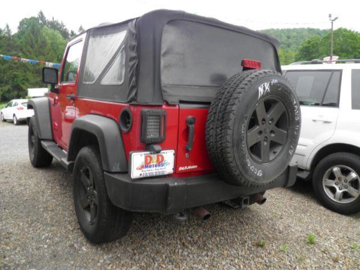 2011 Red Jeep Wrangler Sport (1J4AA2D16BL) with an 3.8L V6 engine, MAN transmission, located at 15520 McMullen Hwy SW, Belair, MD, 21502, (301) 729-3700, 39.581375, -78.846451 - Photo#4