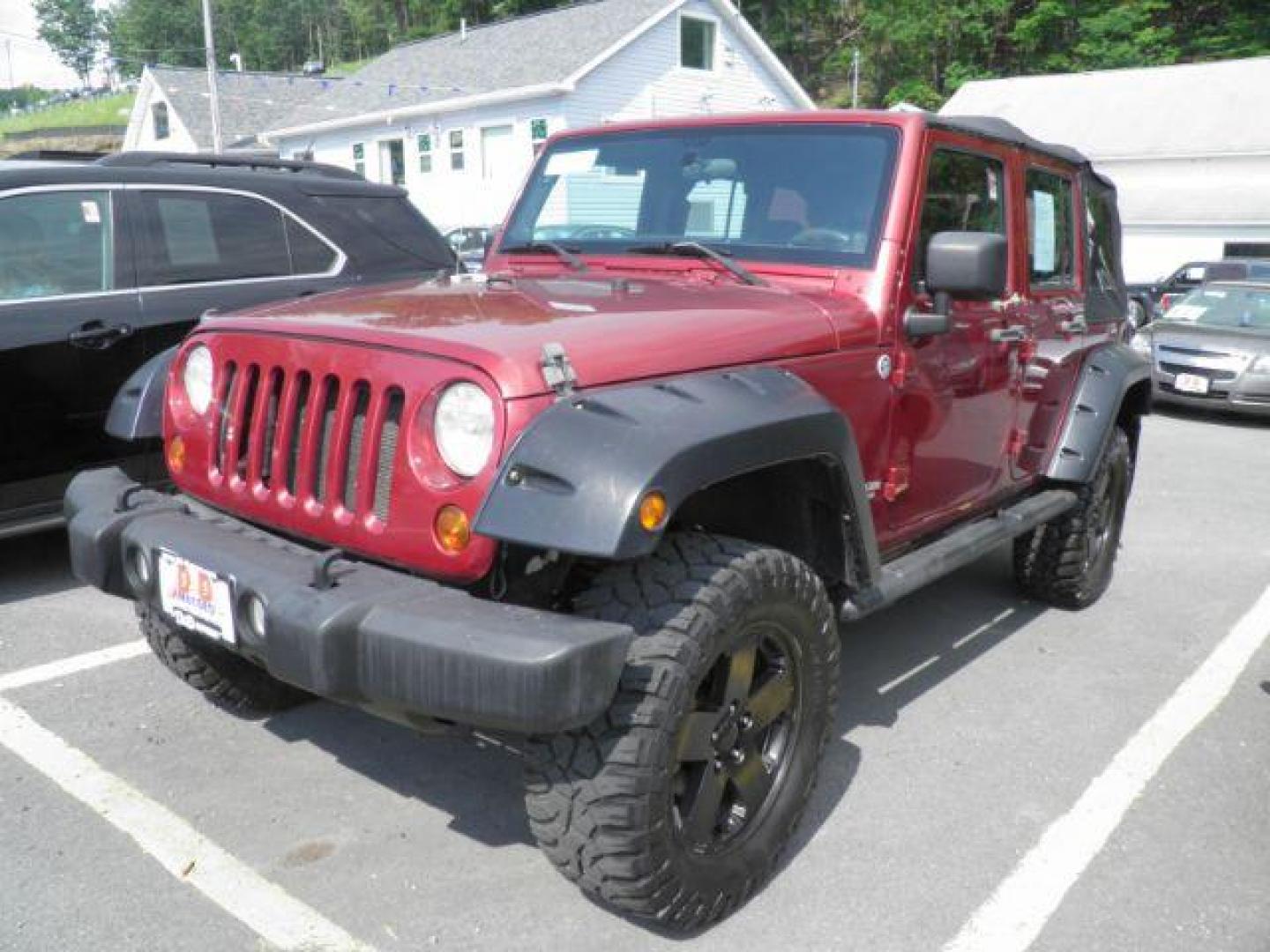 2011 Red Jeep Wrangler Unlimited Sport 4WD (1J4BA3H11BL) with an 3.8L V6 engine, AT transmission, located at 15520 McMullen Hwy SW, Belair, MD, 21502, (301) 729-3700, 39.581375, -78.846451 - Photo#0