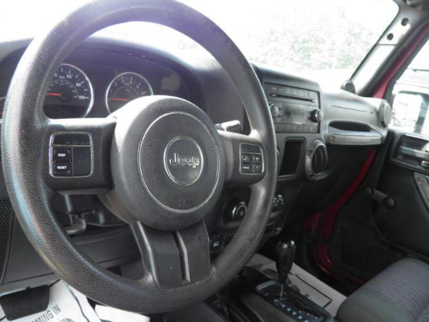 2011 Red Jeep Wrangler Unlimited Sport 4WD (1J4BA3H11BL) with an 3.8L V6 engine, AT transmission, located at 15520 McMullen Hwy SW, Belair, MD, 21502, (301) 729-3700, 39.581375, -78.846451 - Photo#2