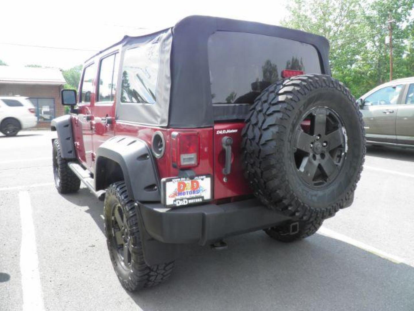 2011 Red Jeep Wrangler Unlimited Sport 4WD (1J4BA3H11BL) with an 3.8L V6 engine, AT transmission, located at 15520 McMullen Hwy SW, Belair, MD, 21502, (301) 729-3700, 39.581375, -78.846451 - Photo#6