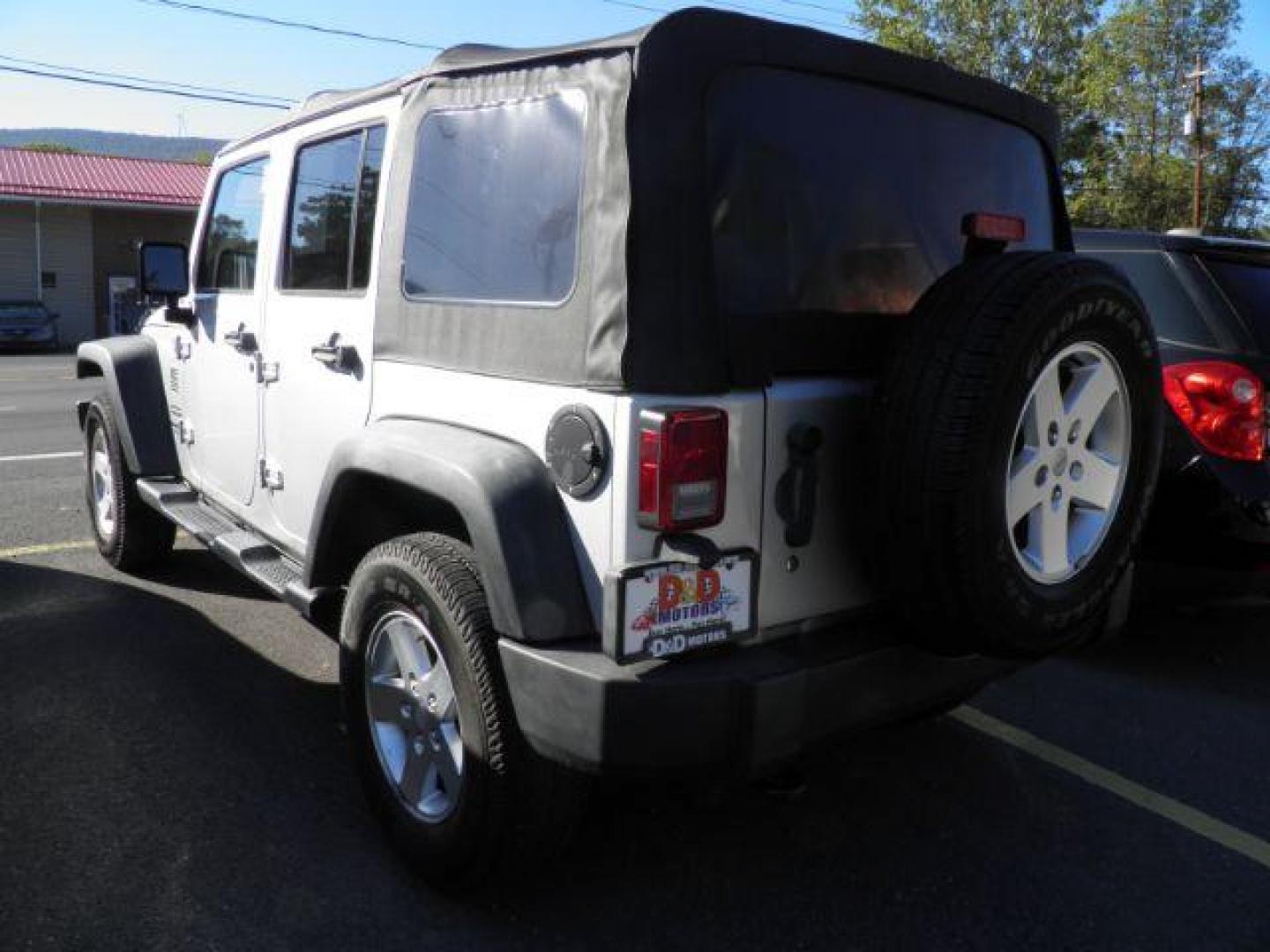 2011 Silver Jeep Wrangler Unlimited Sport (1J4BA3H13BL) with an 3.8L V6 engine, AT transmission, located at 15520 McMullen Hwy SW, Belair, MD, 21502, (301) 729-3700, 39.581375, -78.846451 - Photo#5