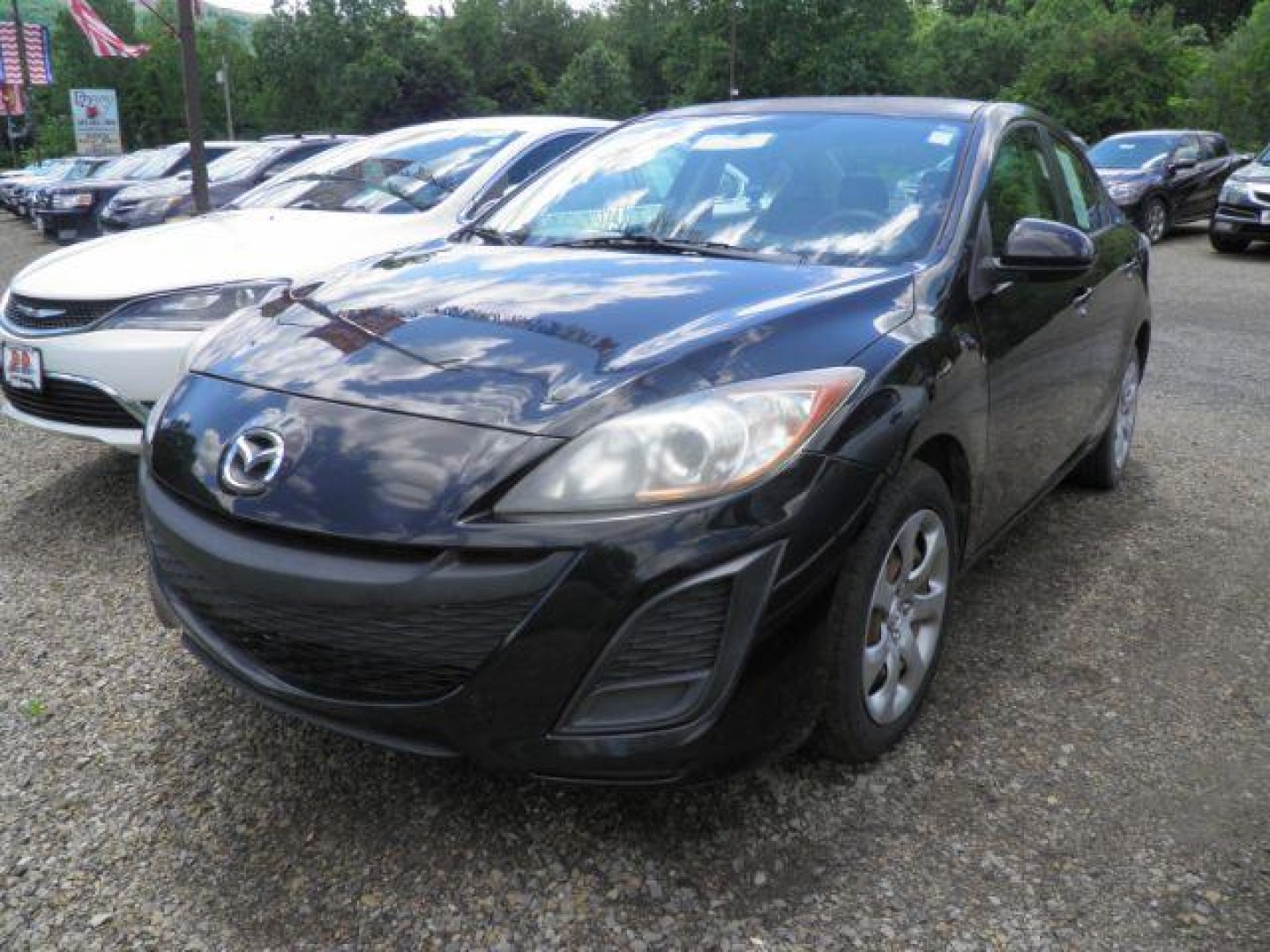 2011 BLACK Mazda MAZDA3 i Sport 4-Door (JM1BL1UF6B1) with an 2.0L L4 engine, 5SP transmission, located at 19521 New George's Creek Rd SW, Barton, MD, 21521, (301) 463-2404, 39.524323, -79.017906- Photo#0