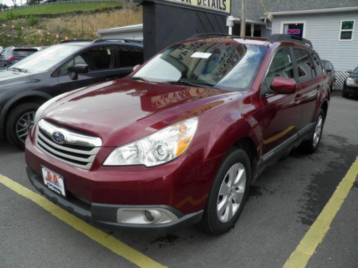 2011 Red Subaru Outback 2.5I Premium (4S4BRBCC4B1) with an 2.5L H4 engine, MAN transmission, located at 15520 McMullen Hwy SW, Belair, MD, 21502, (301) 729-3700, 39.581375, -78.846451 - Photo#0