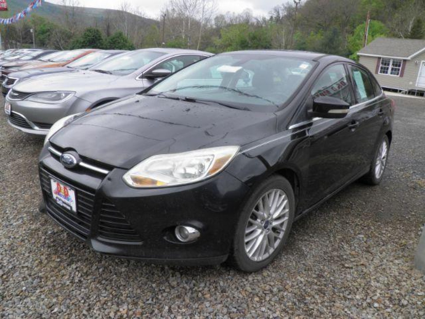 2012 Black Ford Focus SEL Sedan (1FAHP3H2XCL) with an 2.0L I4 engine, AT transmission, located at 19521 New George's Creek Rd SW, Barton, MD, 21521, (301) 463-2404, 39.524323, -79.017906- Photo#0