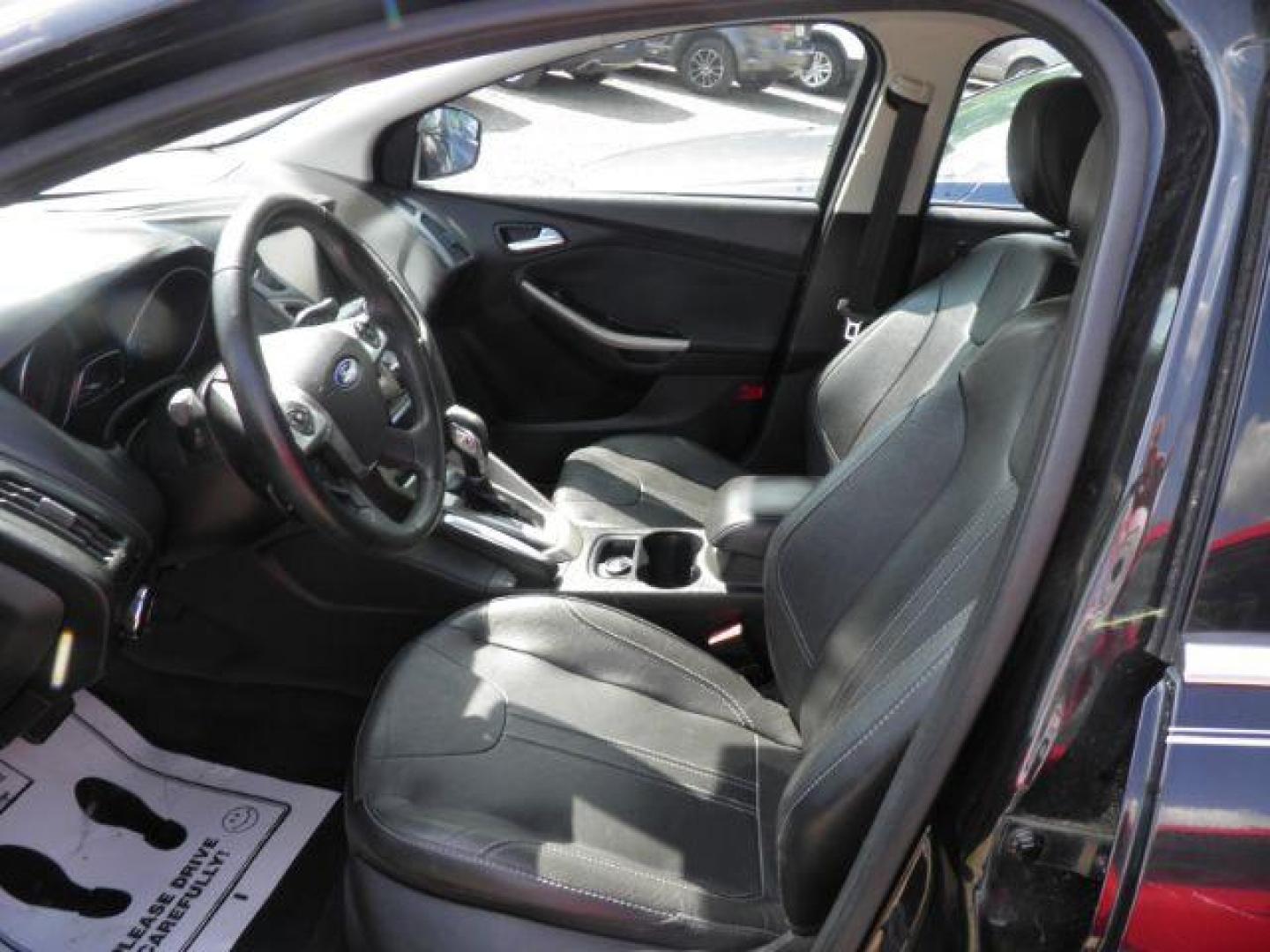 2012 Black Ford Focus SEL Sedan (1FAHP3H2XCL) with an 2.0L I4 engine, AT transmission, located at 19521 New George's Creek Rd SW, Barton, MD, 21521, (301) 463-2404, 39.524323, -79.017906 - Photo#1