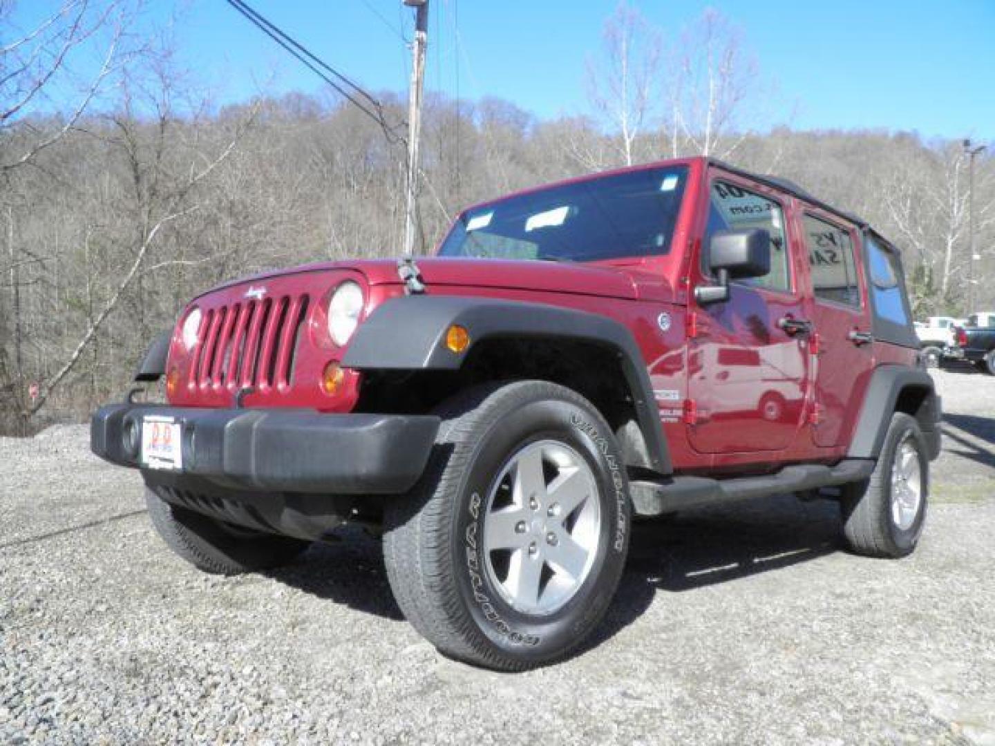 2012 RED Jeep Wrangler Unlimited Sport 4WD (1C4BJWDG6CL) with an 3.6L V6 engine, 6SP transmission, located at 19521 New George's Creek Rd SW, Barton, MD, 21521, (301) 463-2404, 39.524323, -79.017906 - Photo#0