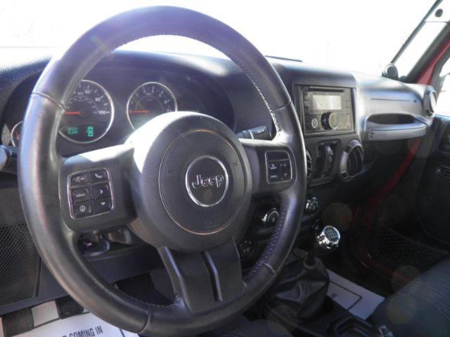 2012 RED Jeep Wrangler Unlimited Sport 4WD (1C4BJWDG6CL) with an 3.6L V6 engine, 6SP transmission, located at 19521 New George's Creek Rd SW, Barton, MD, 21521, (301) 463-2404, 39.524323, -79.017906 - Photo#2
