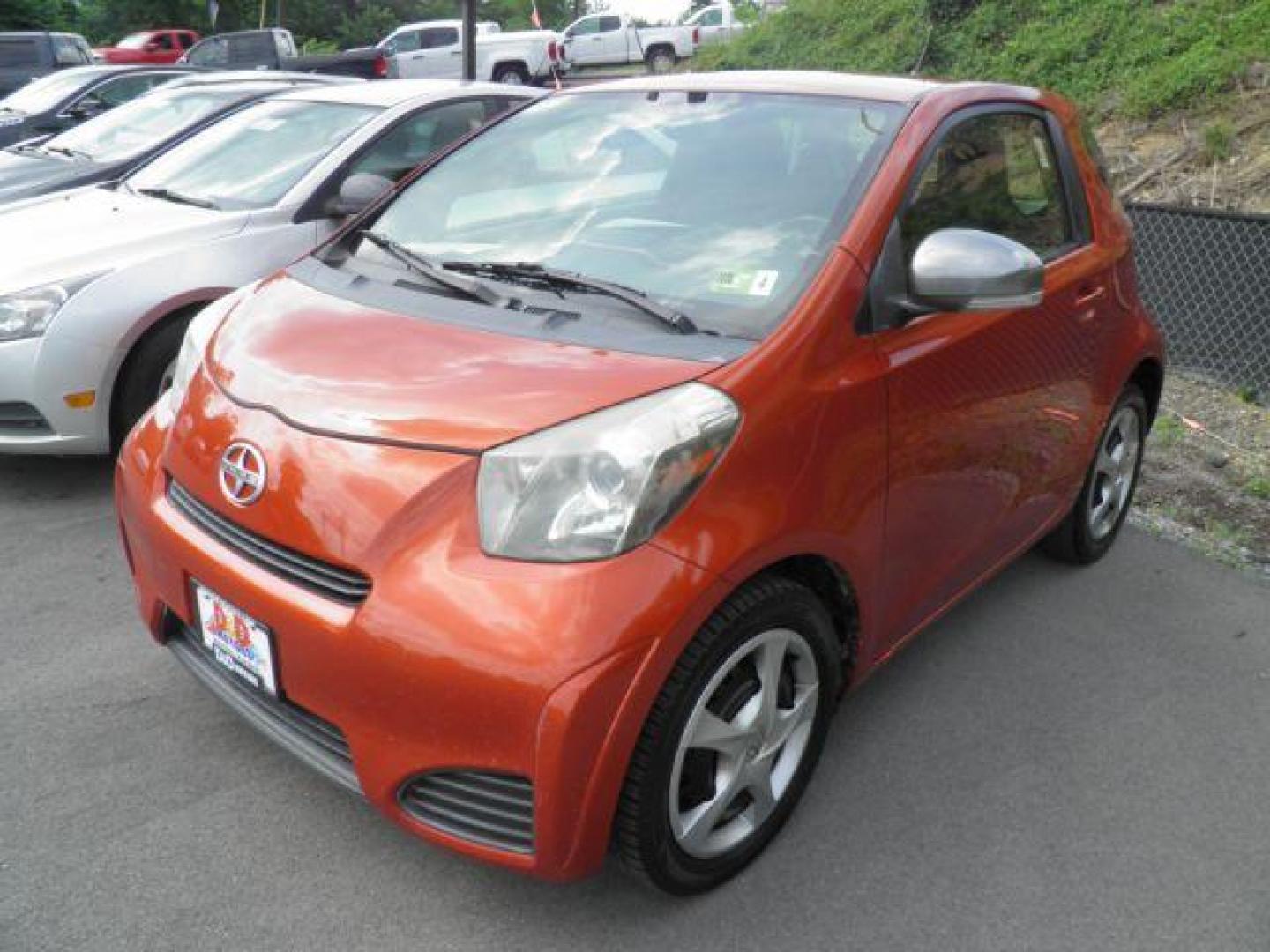 2012 Orange /Deco Black Cloth Interior Scion iQ 3-Door Hatchback AT (JTNJJXB01CJ) with an 1.3L I4 engine, AT transmission, located at 15520 McMullen Hwy SW, Belair, MD, 21502, (301) 729-3700, 39.581375, -78.846451 - Photo#0