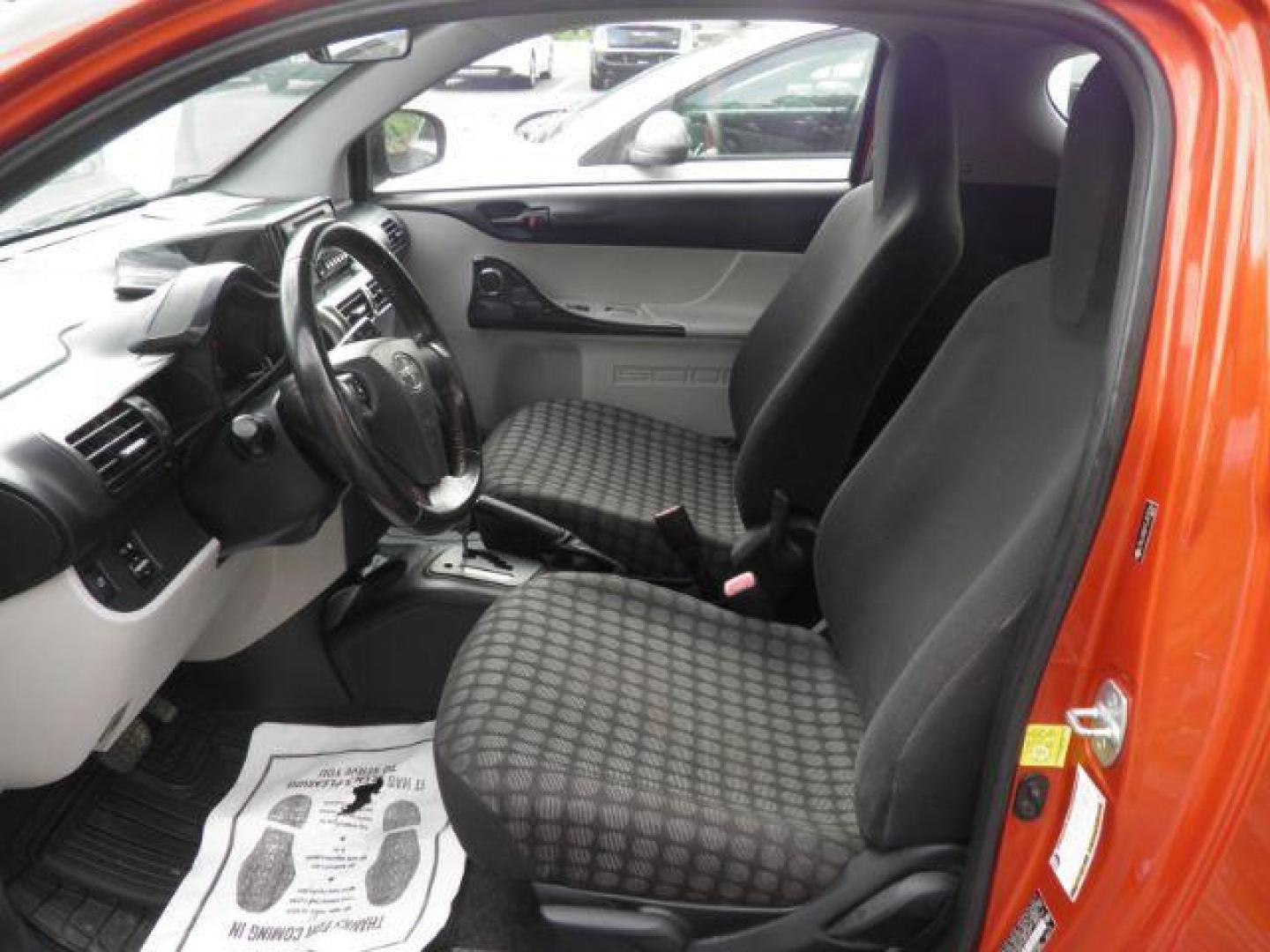 2012 Orange /Deco Black Cloth Interior Scion iQ 3-Door Hatchback AT (JTNJJXB01CJ) with an 1.3L I4 engine, AT transmission, located at 15520 McMullen Hwy SW, Belair, MD, 21502, (301) 729-3700, 39.581375, -78.846451 - Photo#1