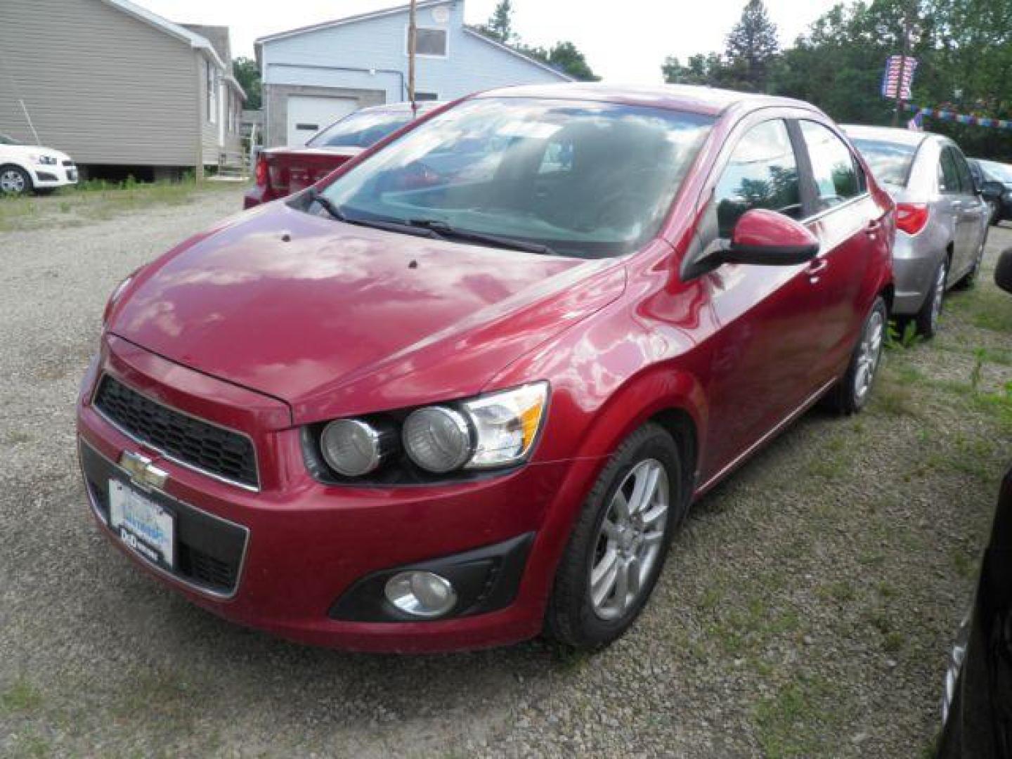 2013 Red Chevrolet Sonic LT Auto Sedan (1G1JC5SH0D4) with an 1.8L I4 engine, AT transmission, located at 19521 New George's Creek Rd SW, Barton, MD, 21521, (301) 463-2404, 39.524323, -79.017906 - Photo#0