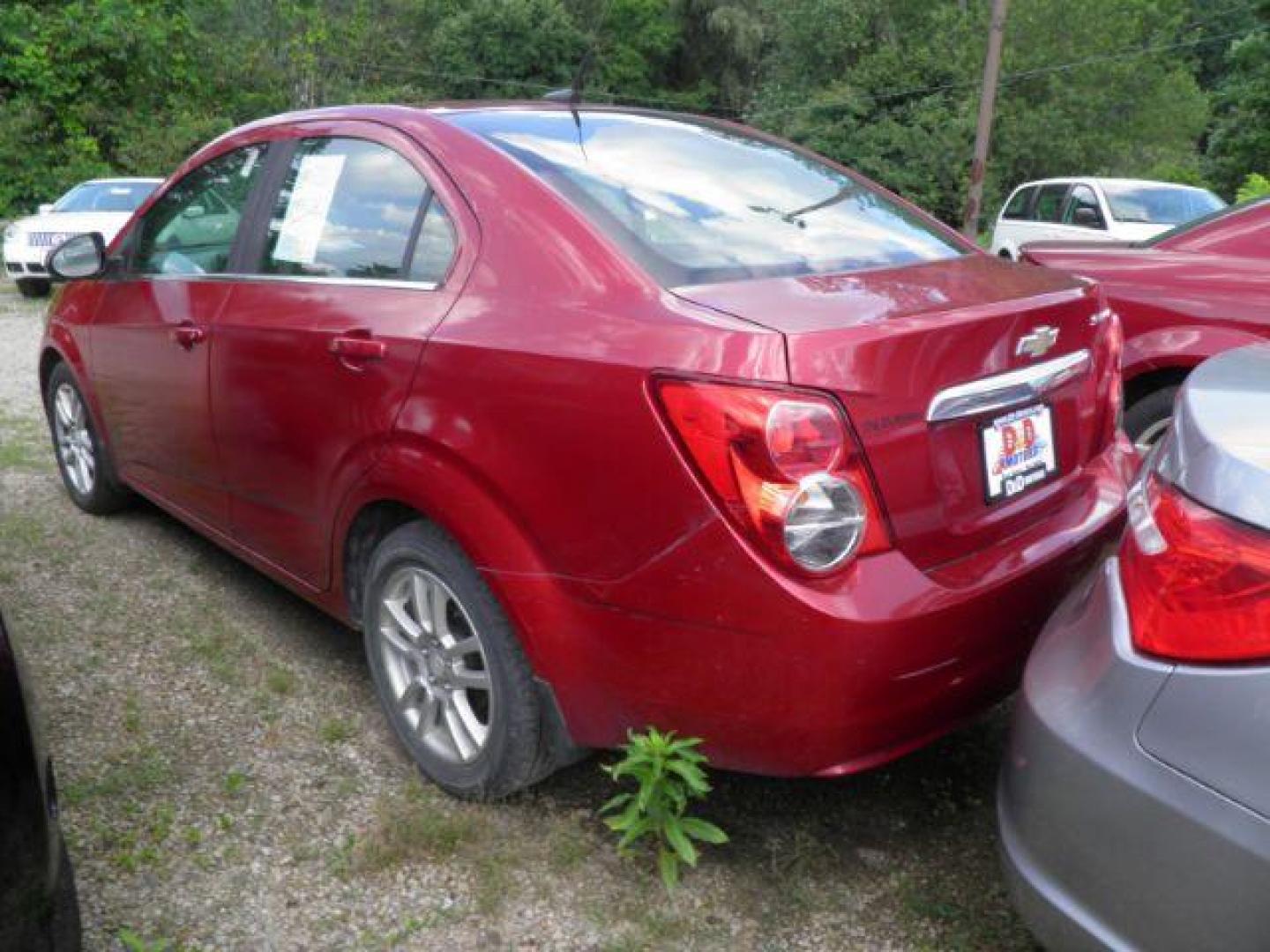 2013 Red Chevrolet Sonic LT Auto Sedan (1G1JC5SH0D4) with an 1.8L I4 engine, AT transmission, located at 19521 New George's Creek Rd SW, Barton, MD, 21521, (301) 463-2404, 39.524323, -79.017906 - Photo#4