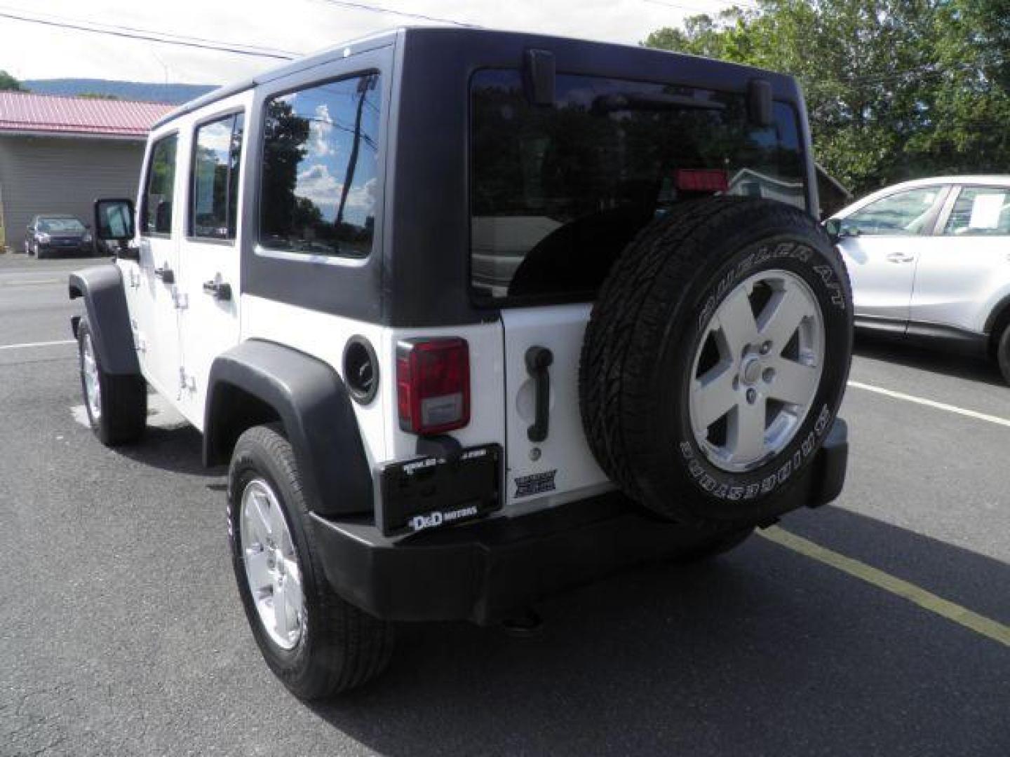 2013 White Jeep Wrangler Unlimited Sport (1C4BJWDGXDL) with an 3.6L V6 engine, AT transmission, located at 15520 McMullen Hwy SW, Belair, MD, 21502, (301) 729-3700, 39.581375, -78.846451 - Photo#5