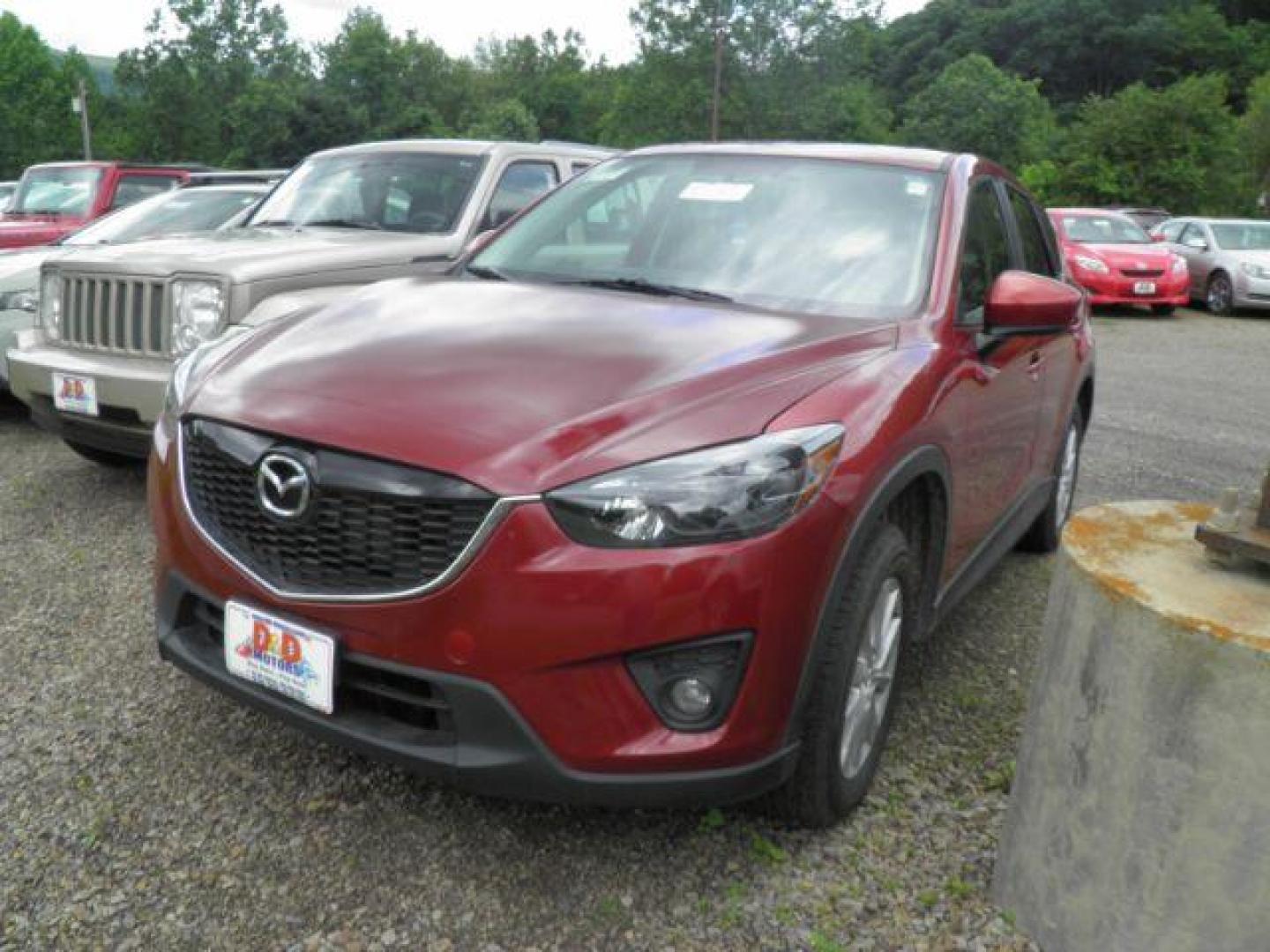 2013 Red Mazda CX-5 Touring (JM3KE4CE4D0) with an 2.4L I4 engine, located at 19521 New George's Creek Rd SW, Barton, MD, 21521, (301) 463-2404, 39.524323, -79.017906 - Photo#0