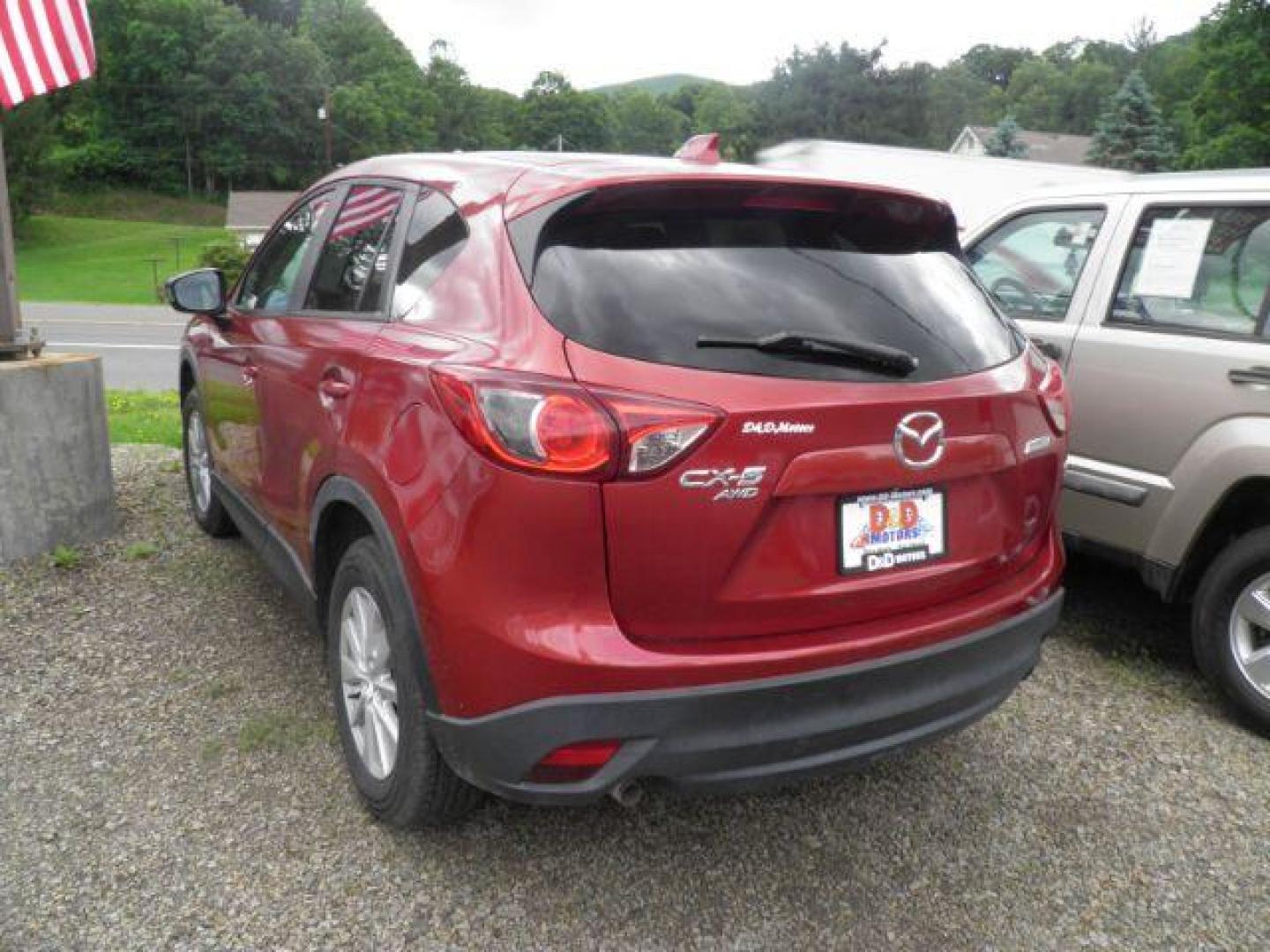 2013 Red Mazda CX-5 Touring (JM3KE4CE4D0) with an 2.4L I4 engine, located at 19521 New George's Creek Rd SW, Barton, MD, 21521, (301) 463-2404, 39.524323, -79.017906 - Photo#5