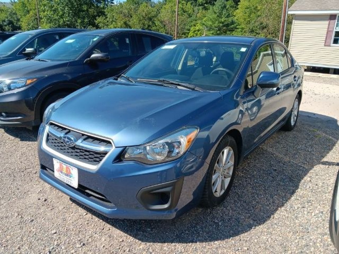 2013 BLUE Subaru Impreza 2.0i Premium (JF1GJAB63DH) with an 2.4L L4 engine, CVT transmission, located at 19521 New George's Creek Rd SW, Barton, MD, 21521, (301) 463-2404, 39.524323, -79.017906- Photo#0