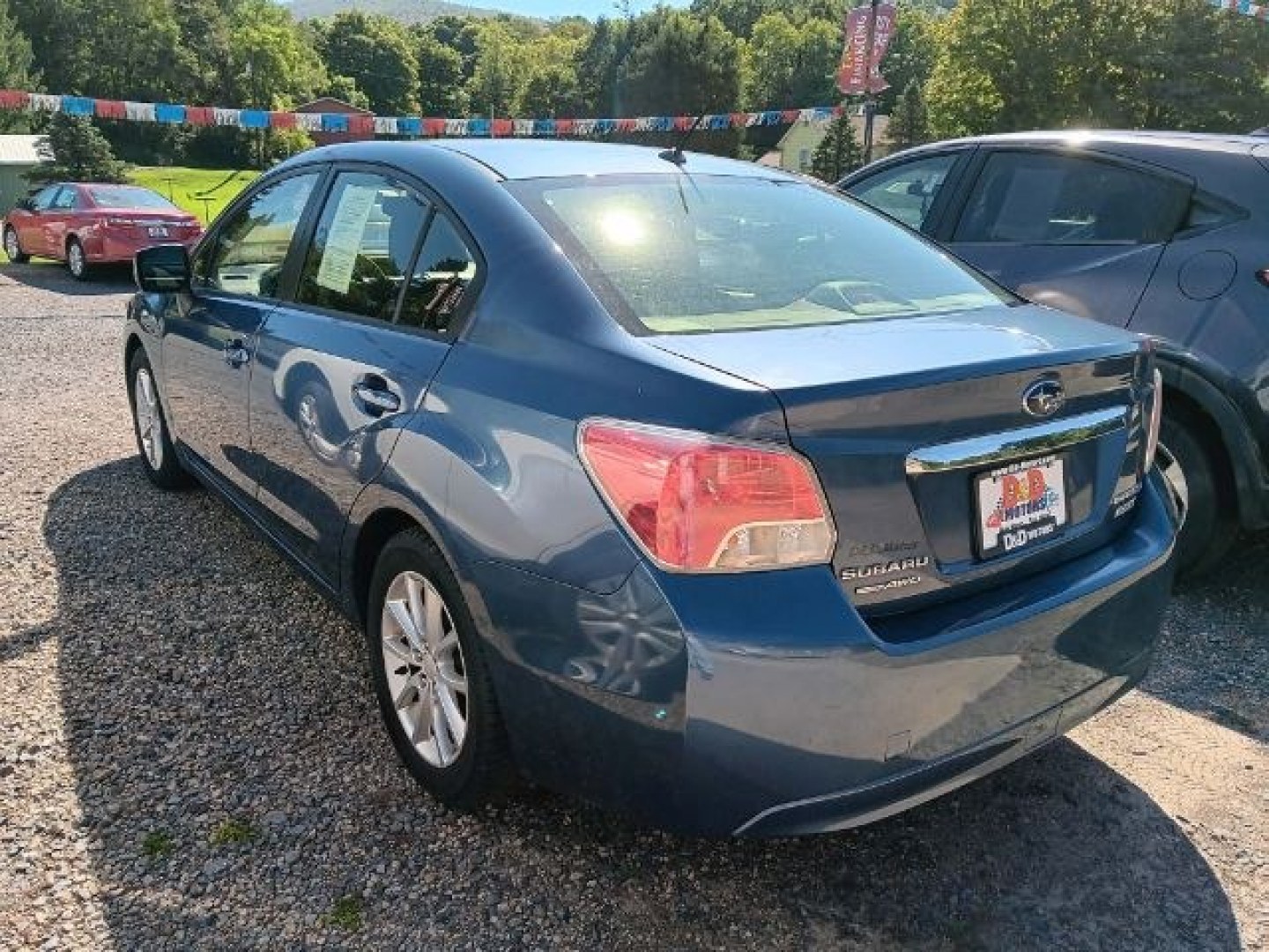 2013 BLUE Subaru Impreza 2.0i Premium (JF1GJAB63DH) with an 2.4L L4 engine, CVT transmission, located at 19521 New George's Creek Rd SW, Barton, MD, 21521, (301) 463-2404, 39.524323, -79.017906- Photo#3