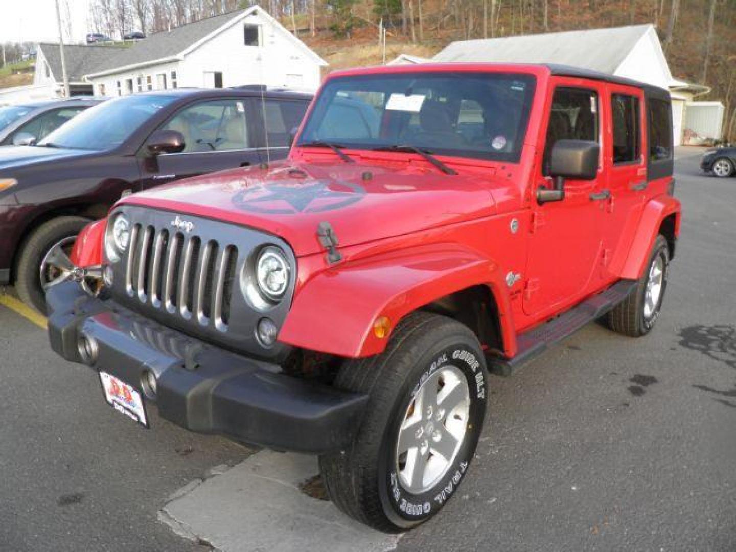 2014 Red Jeep Wrangler Unlimited Freedom Edition (1C4BJWDGXEL) with an 3.6L V6 engine, AT transmission, located at 15520 McMullen Hwy SW, Belair, MD, 21502, (301) 729-3700, 39.581375, -78.846451 - Photo#0