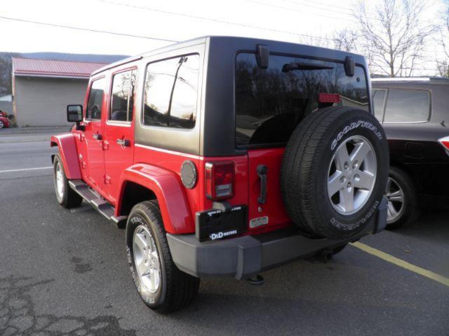 2014 Red Jeep Wrangler Unlimited Freedom Edition (1C4BJWDGXEL) with an 3.6L V6 engine, AT transmission, located at 15520 McMullen Hwy SW, Belair, MD, 21502, (301) 729-3700, 39.581375, -78.846451 - Photo#5