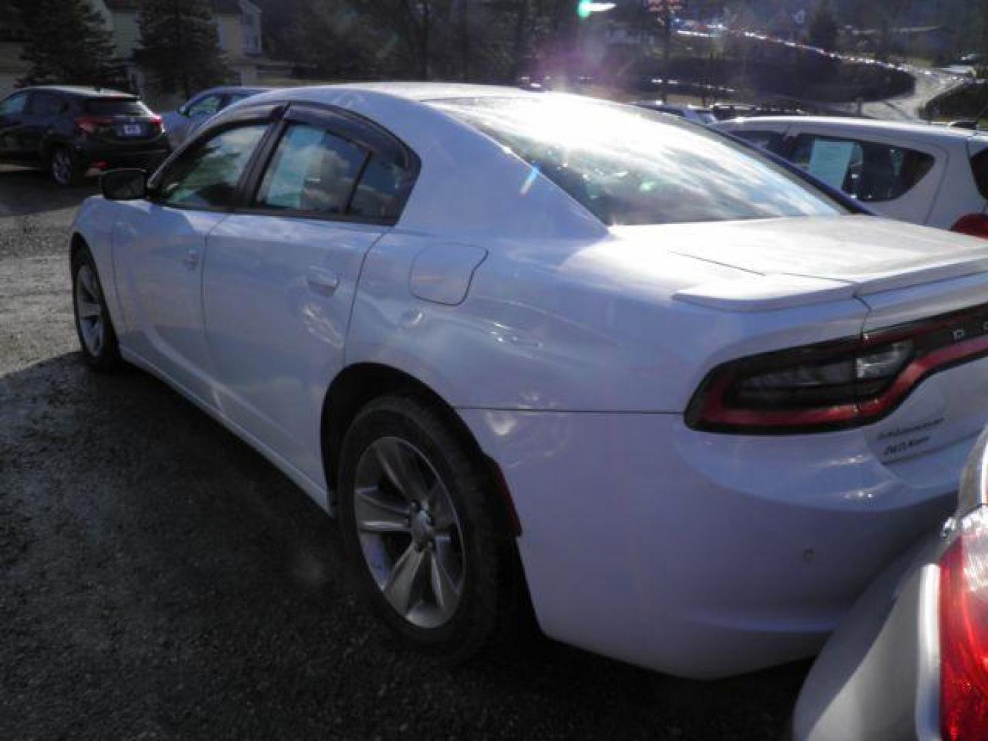 2015 White Dodge Charger SE (2C3CDXBG8FH) with an 3.6L V6 engine, AT transmission, located at 15520 McMullen Hwy SW, Belair, MD, 21502, (301) 729-3700, 39.581375, -78.846451 - Photo#4