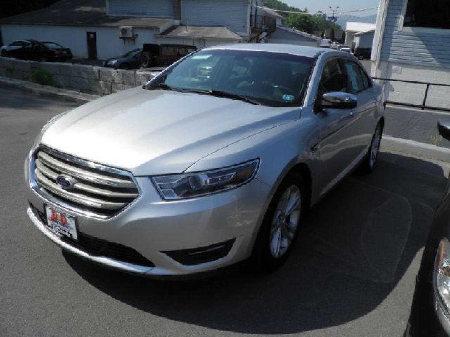 2015 Silver Ford Taurus SEL (1FAHP2H83FG) with an 3.5L V6 engine, AT transmission, located at 15520 McMullen Hwy SW, Belair, MD, 21502, (301) 729-3700, 39.581375, -78.846451 - Photo#0
