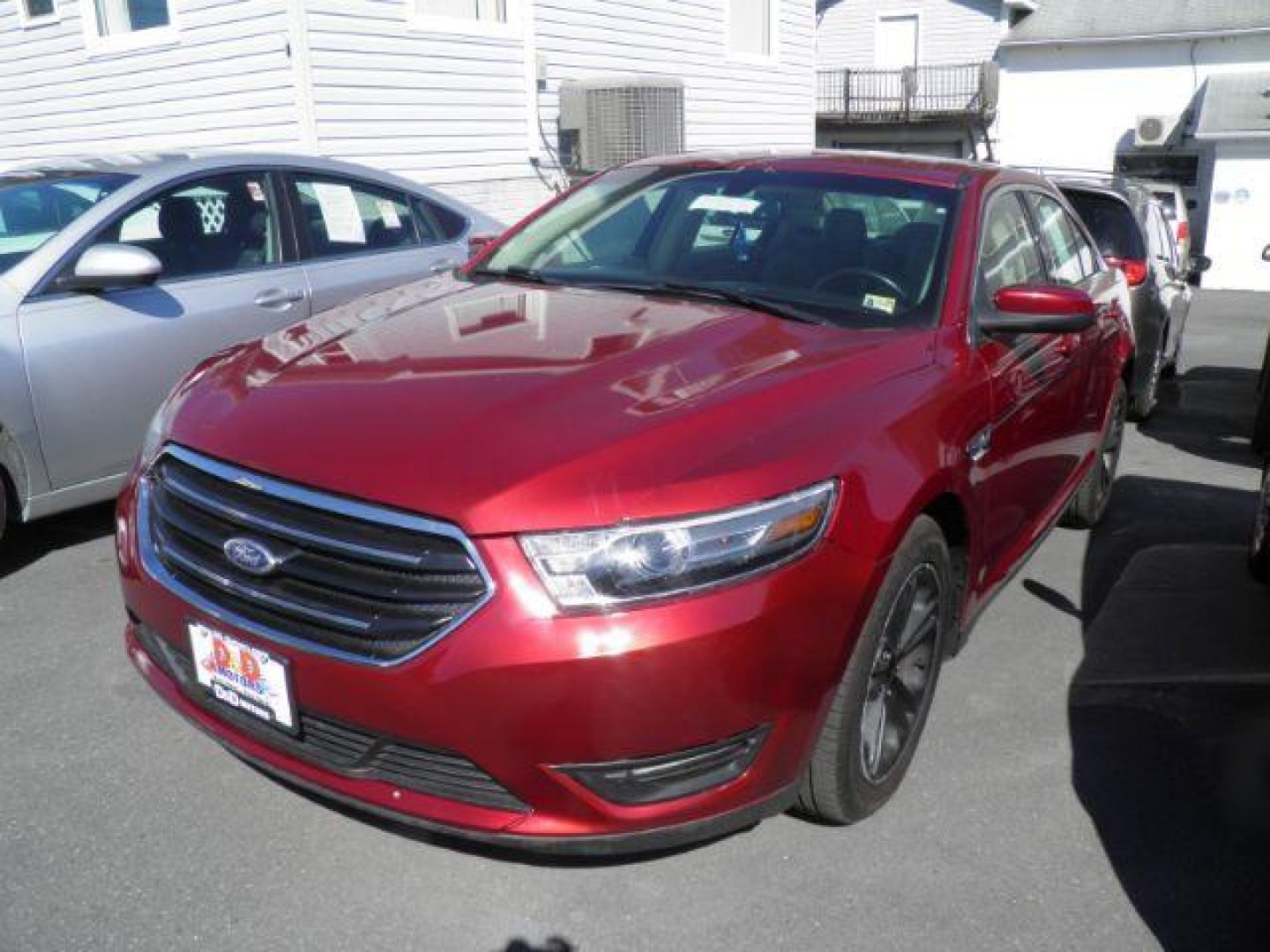 2015 Red Ford Taurus SEL (1FAHP2E88FG) with an 3.5L V6 engine, AT transmission, located at 15520 McMullen Hwy SW, Belair, MD, 21502, (301) 729-3700, 39.581375, -78.846451 - Photo#0