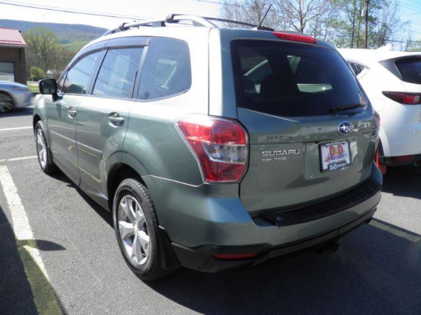 2015 GREEN Subaru Forester 2.5i Premium (JF2SJADC9FG) with an 2.5 L4 engine, 5/SP transmission, located at 15520 McMullen Hwy SW, Belair, MD, 21502, (301) 729-3700, 39.581375, -78.846451 - Photo#5