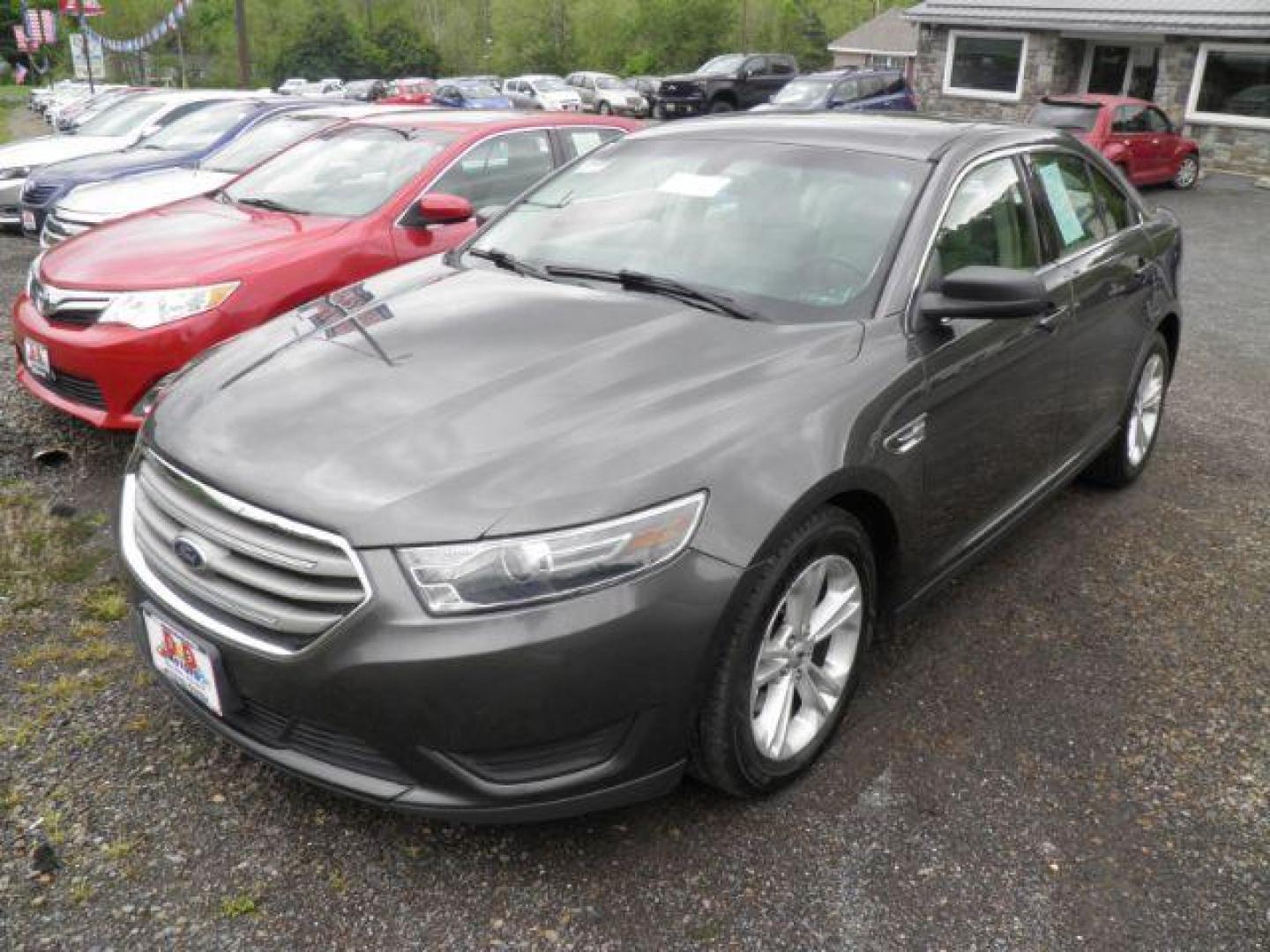 2016 GRAY Ford Taurus SE (1FAHP2D88GG) with an 2.4L L4 engine, AT transmission, located at 19521 New George's Creek Rd SW, Barton, MD, 21521, (301) 463-2404, 39.524323, -79.017906 - Photo#0