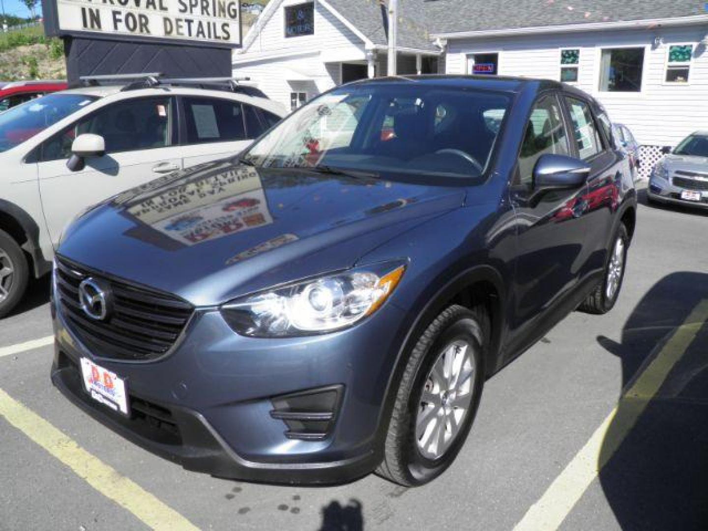 2016 Blue Mazda CX-5 Sport (JM3KE4BY5G0) with an 2.5L I4 engine, AT transmission, located at 19521 New George's Creek Rd SW, Barton, MD, 21521, (301) 463-2404, 39.524323, -79.017906 - Photo#0