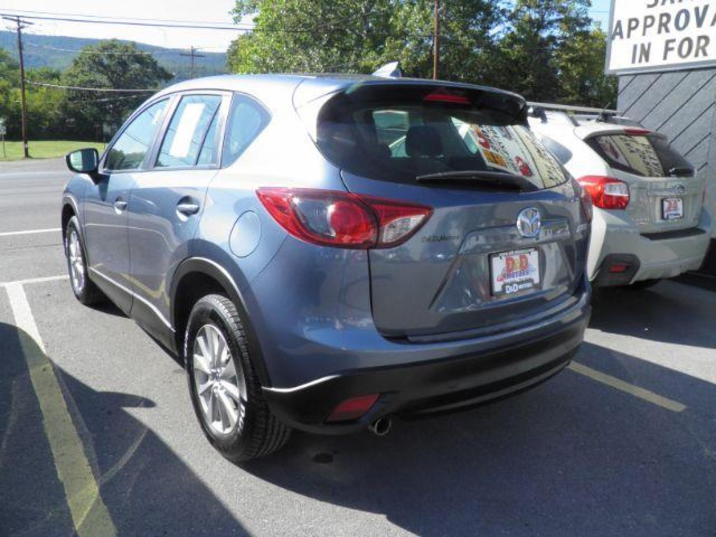 2016 Blue Mazda CX-5 Sport (JM3KE4BY5G0) with an 2.5L I4 engine, AT transmission, located at 19521 New George's Creek Rd SW, Barton, MD, 21521, (301) 463-2404, 39.524323, -79.017906 - Photo#5