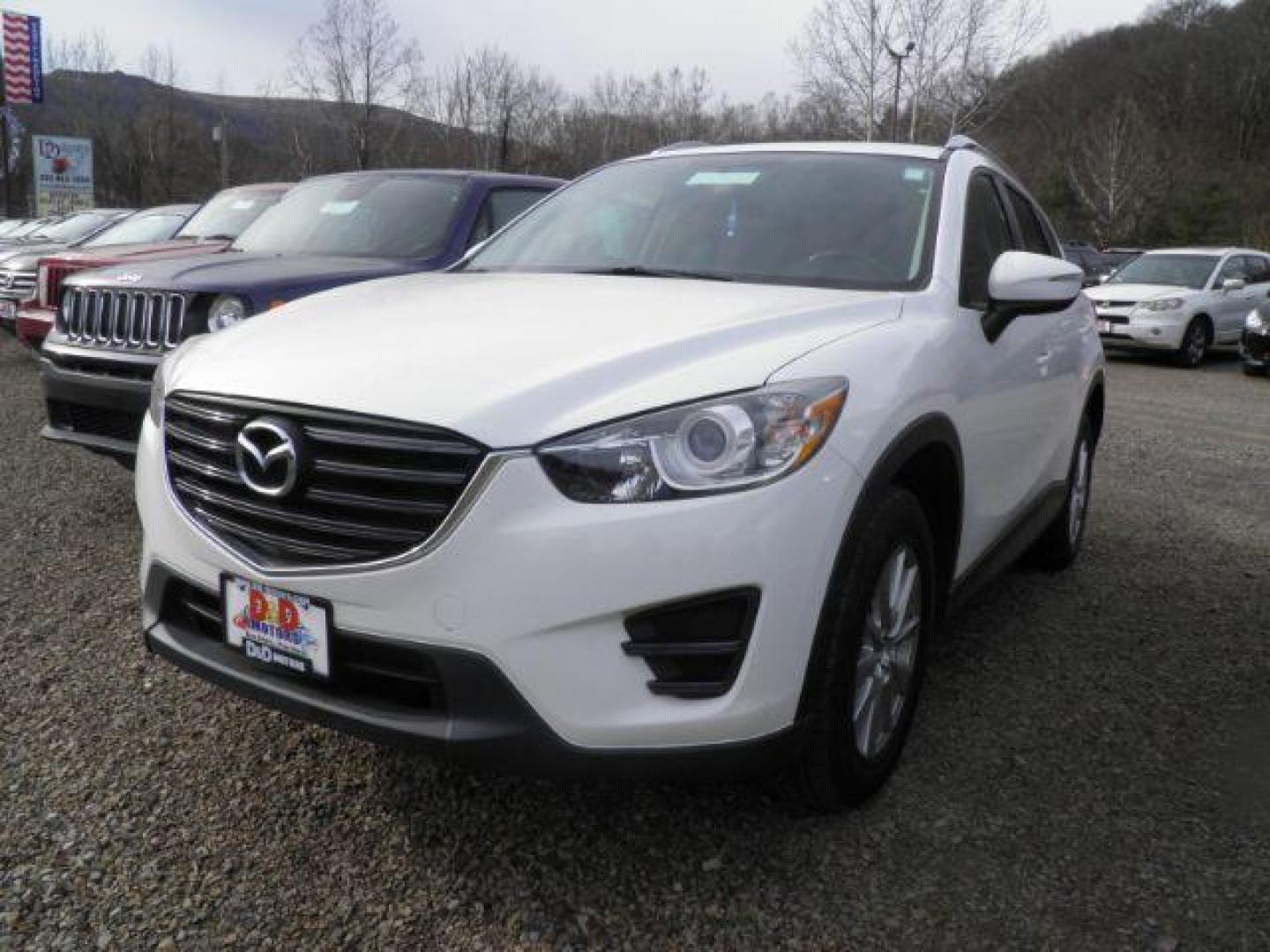 2016 WHITE Mazda CX-5 Sport (JM3KE4BY6G0) with an 2.5 L4 engine, CVT transmission, located at 19521 New George's Creek Rd SW, Barton, MD, 21521, (301) 463-2404, 39.524323, -79.017906 - Photo#0