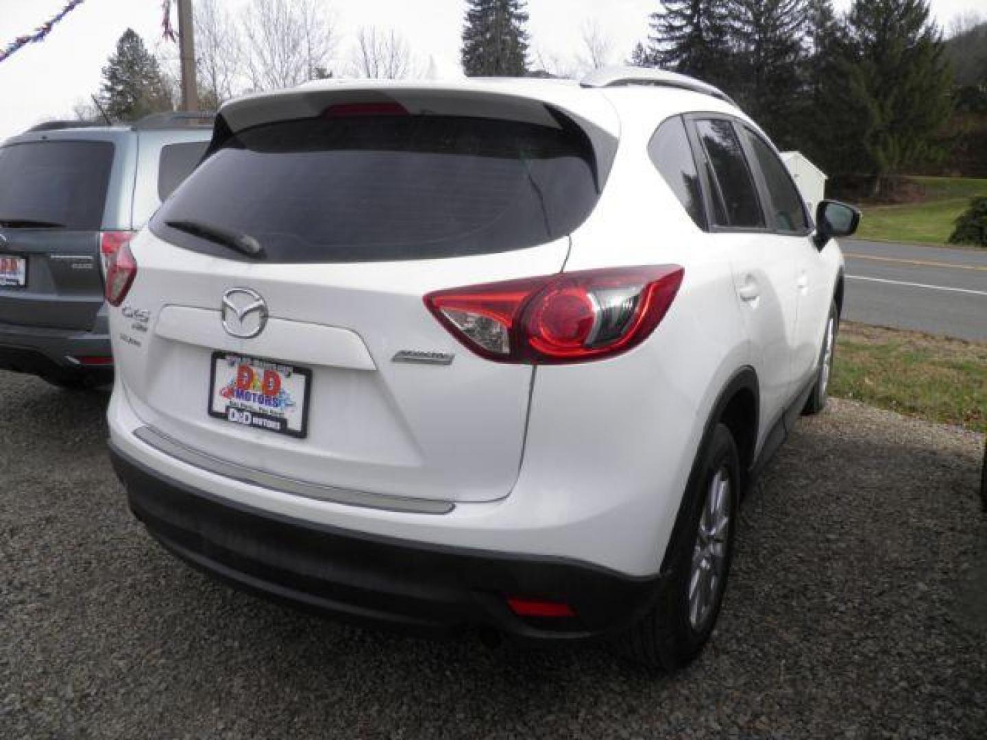 2016 WHITE Mazda CX-5 Sport (JM3KE4BY6G0) with an 2.5 L4 engine, CVT transmission, located at 19521 New George's Creek Rd SW, Barton, MD, 21521, (301) 463-2404, 39.524323, -79.017906 - Photo#5