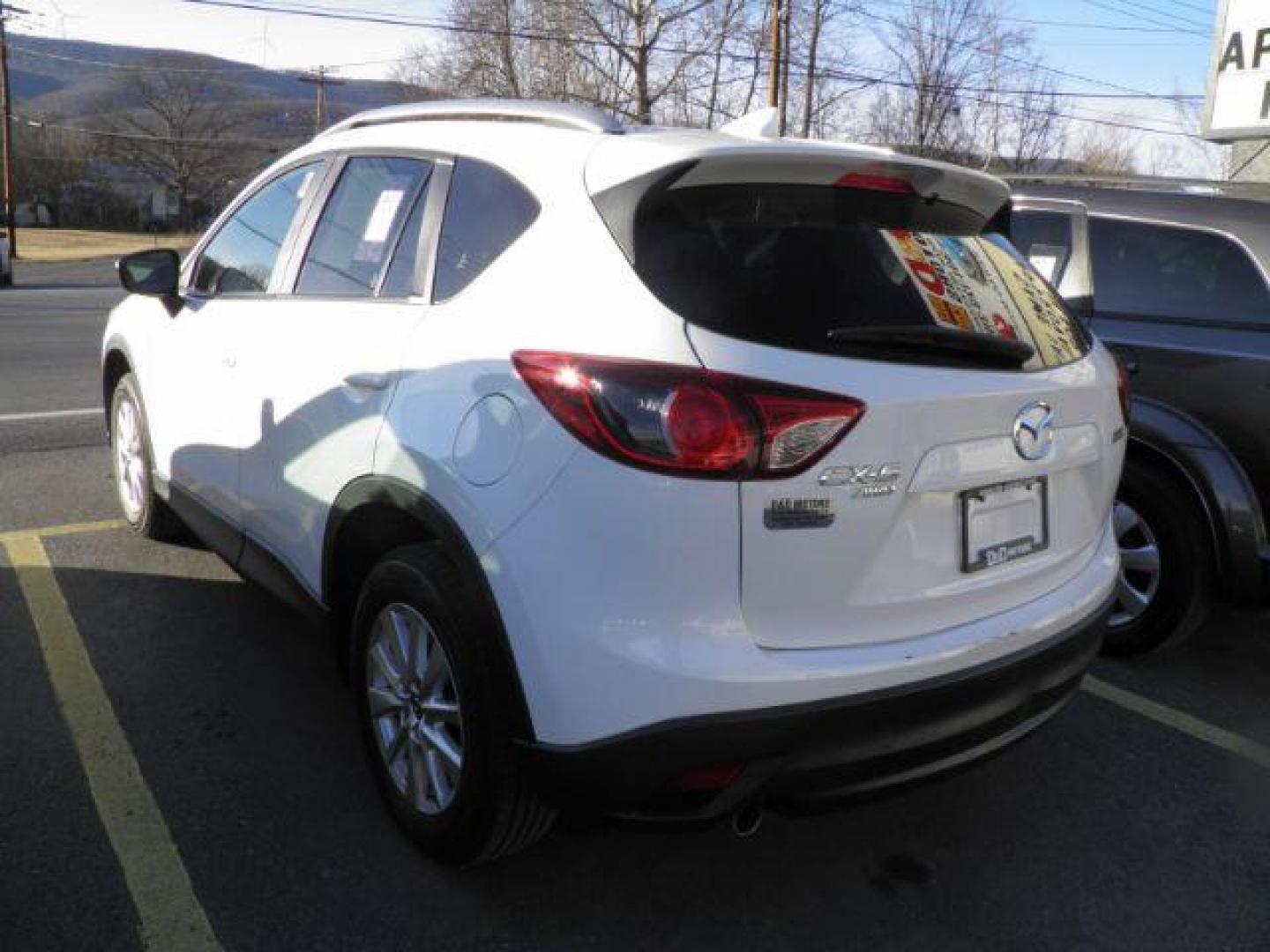 2016 White Mazda CX-5 Touring (JM3KE4CY9G0) with an 2.5L I4 engine, AT transmission, located at 15520 McMullen Hwy SW, Belair, MD, 21502, (301) 729-3700, 39.581375, -78.846451 - Photo#5