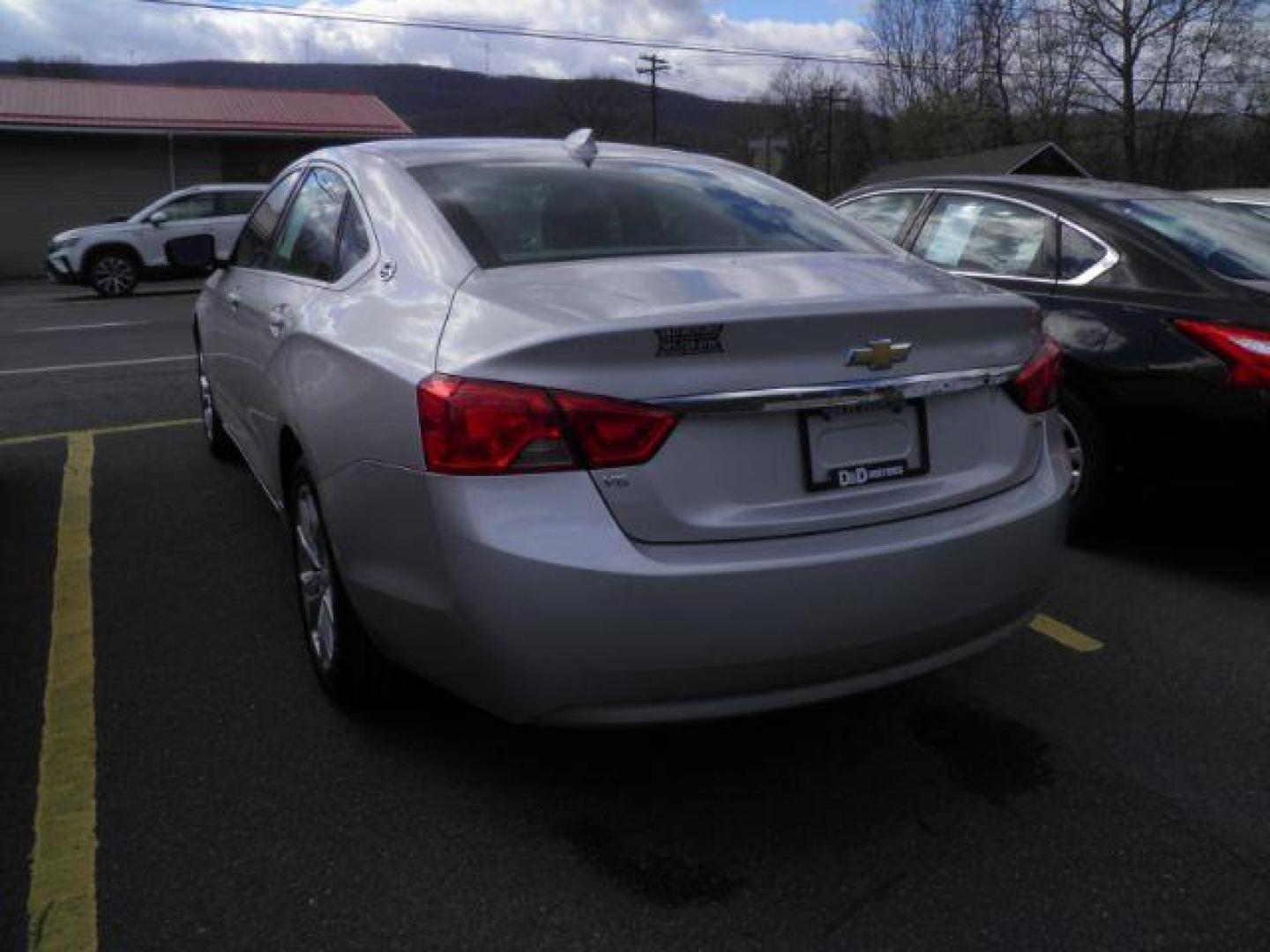 2017 Gray Chevrolet Impala 1LT (2G1105S34H9) with an 3.6L V6 engine, AT transmission, located at 19521 New George's Creek Rd SW, Barton, MD, 21521, (301) 463-2404, 39.524323, -79.017906 - Photo#4