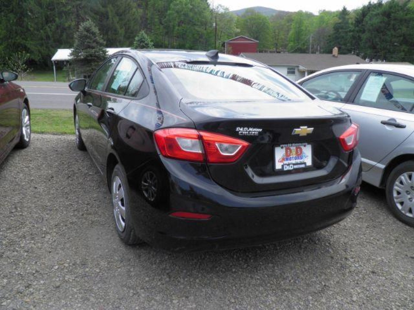 2017 BLACK Chevrolet Cruze LS Auto (1G1BC5SM1H7) with an 1.4l L4T engine, AT transmission, located at 19521 New George's Creek Rd SW, Barton, MD, 21521, (301) 463-2404, 39.524323, -79.017906- Photo#4