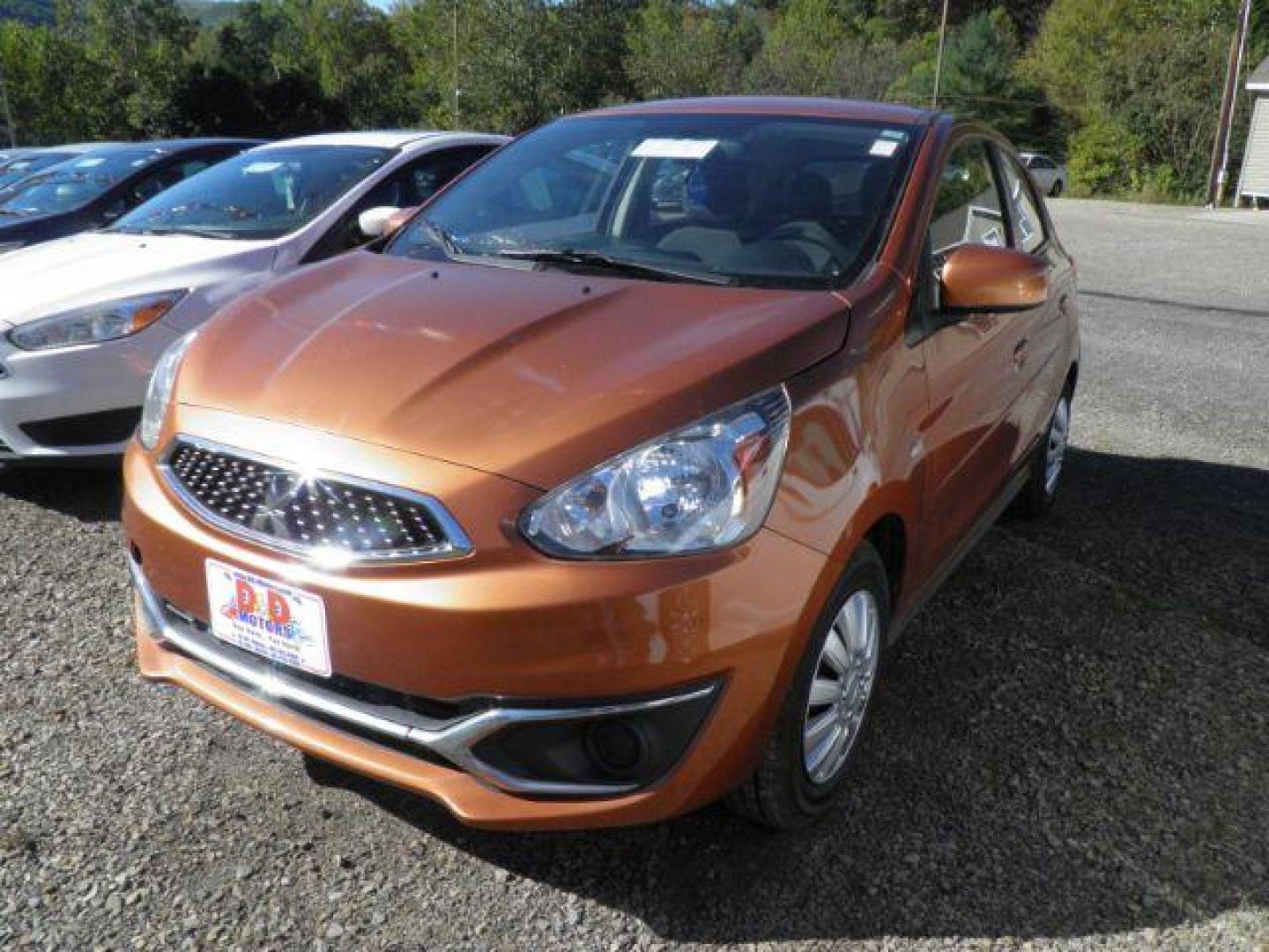2019 Orange Mitsubishi Mirage ES 5M (ML32A3HJ6KH) with an 1.2L I3 engine, AT transmission, located at 19521 New George's Creek Rd SW, Barton, MD, 21521, (301) 463-2404, 39.524323, -79.017906- Photo#0